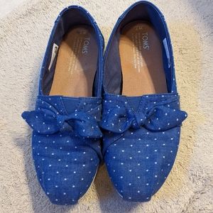 Blue polka-dot TOMS with bow
